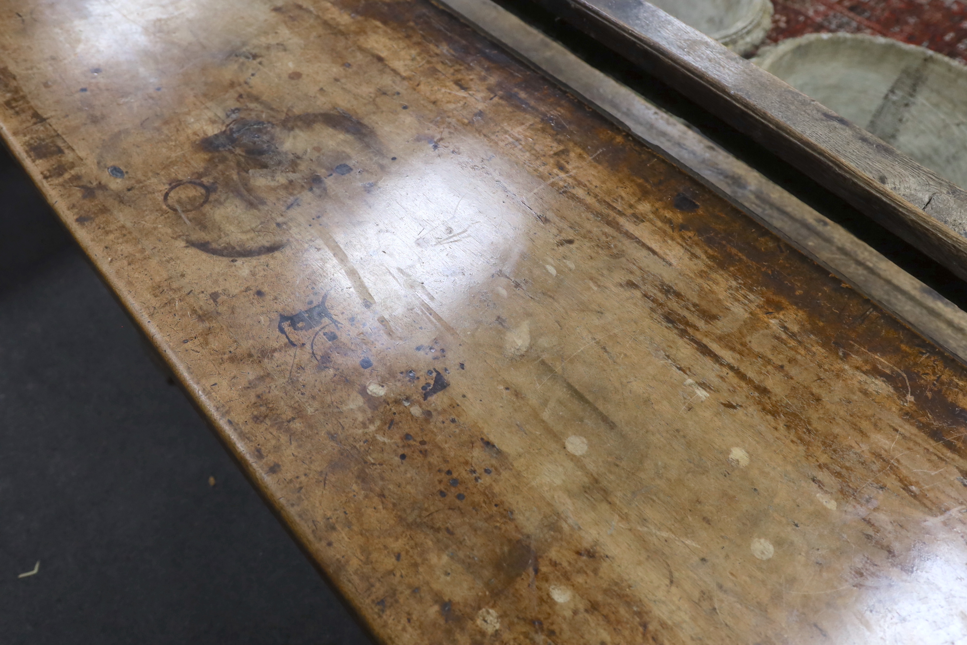 An 18th century style walnut refectory table, width 270cm, depth 59cm, height 74cm, Provenance- Brede Place, East Sussex, a former residence of the Frewen family from 1712-1936.